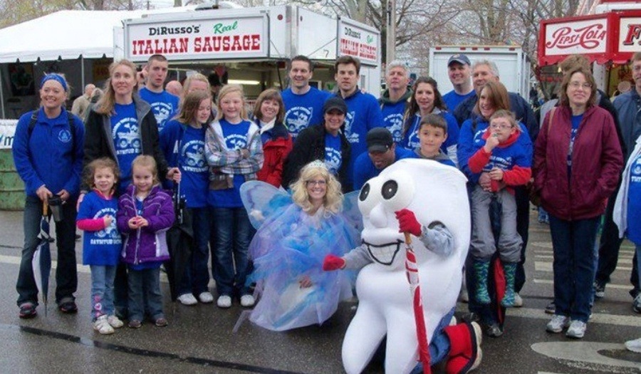 Dental team members and tooth mascot at Chardon Maple Festival